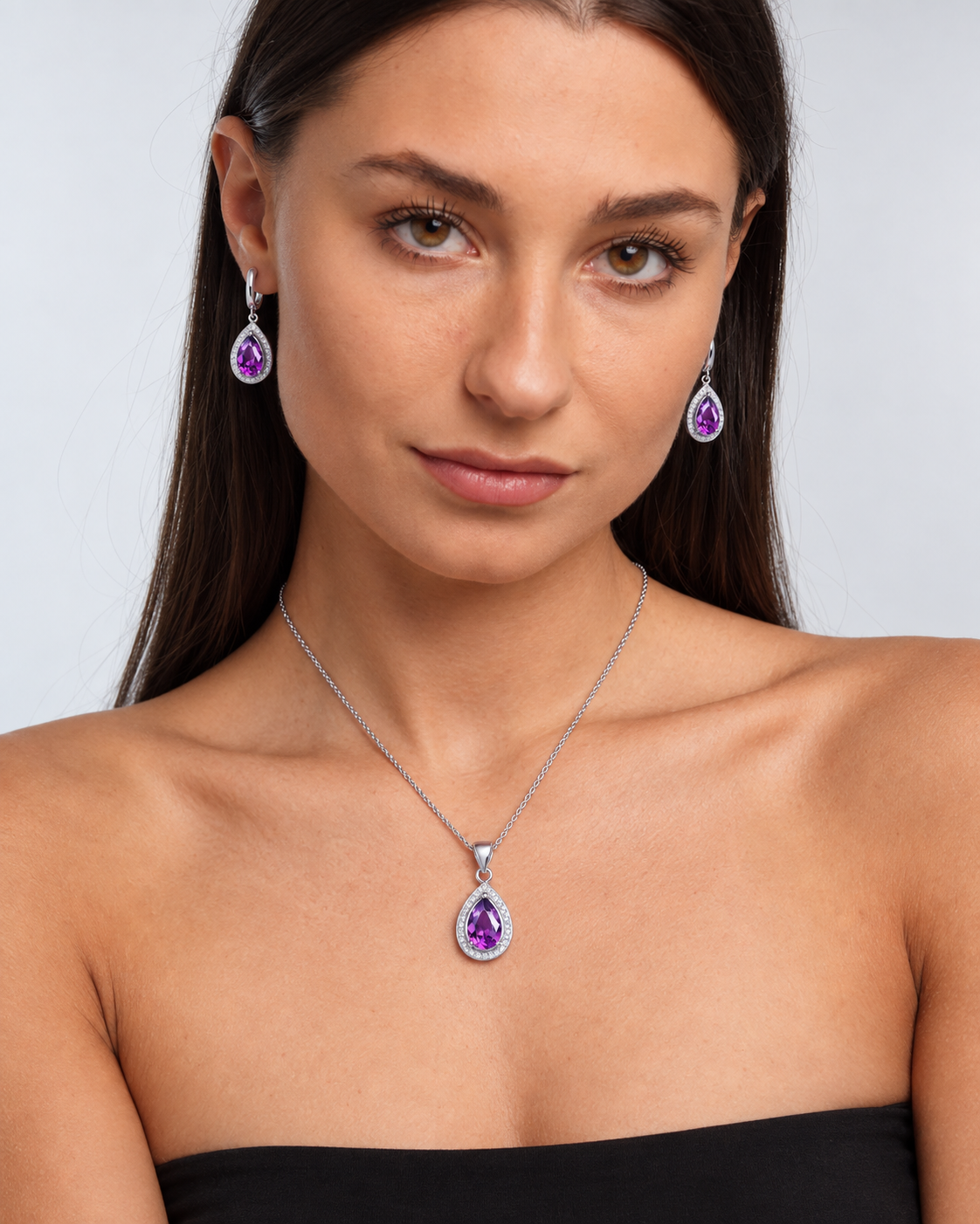 Colour Crystal Teardrop Necklace & Earring Set in Purple, worn by a model in a front portrait - Ravyena