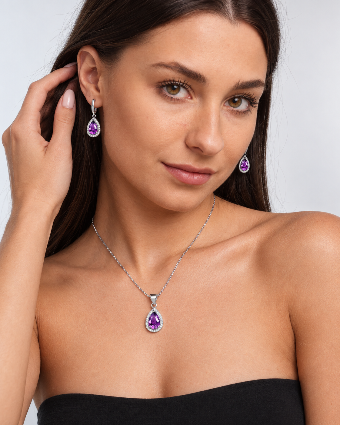 Colour Crystal Teardrop Necklace & Earring Set in Purple, worn by a model in a three-quarter portrait - Ravyena