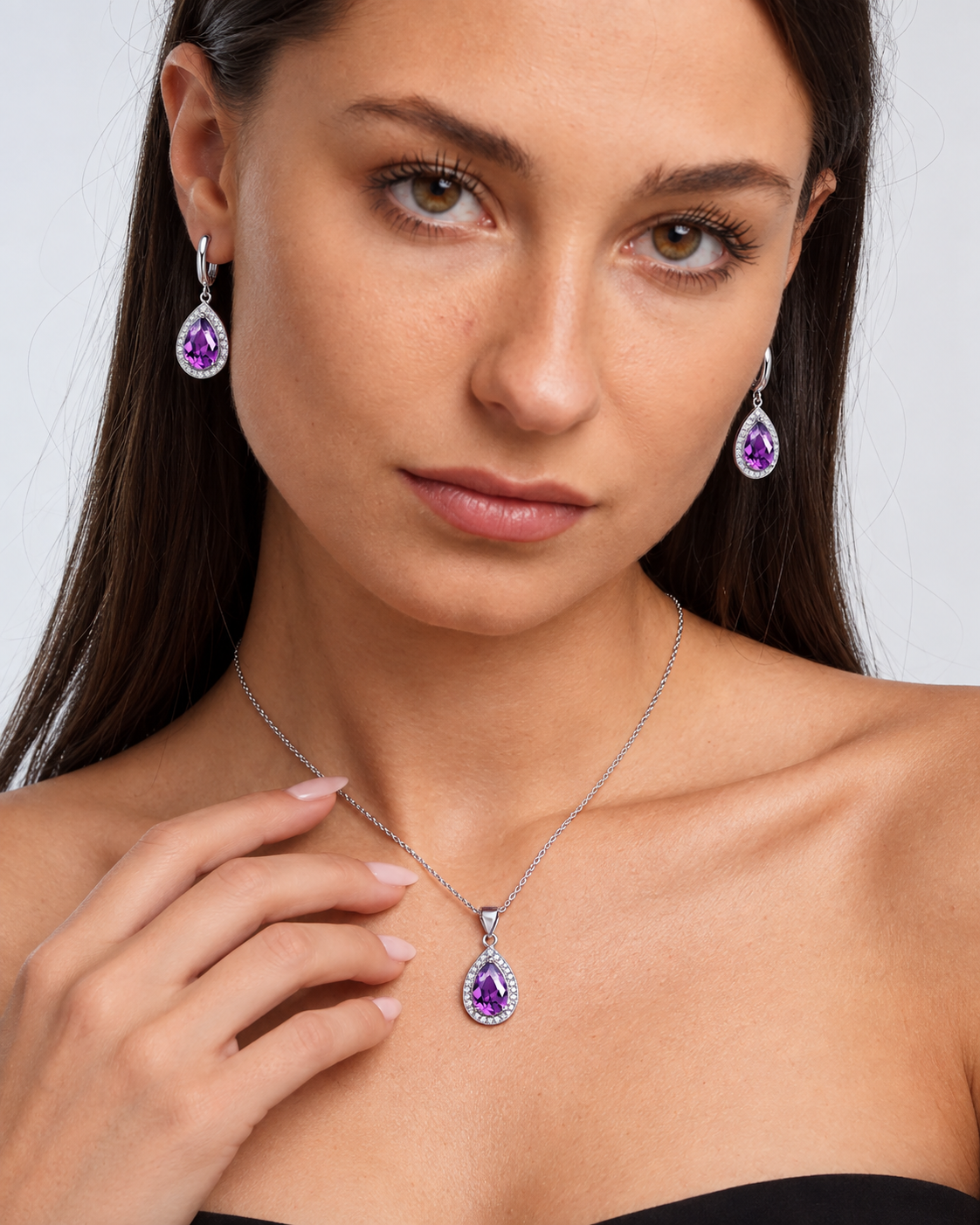 Colour Crystal Teardrop Necklace & Earring Set in Purple, worn by a model in a close-up - Ravyena