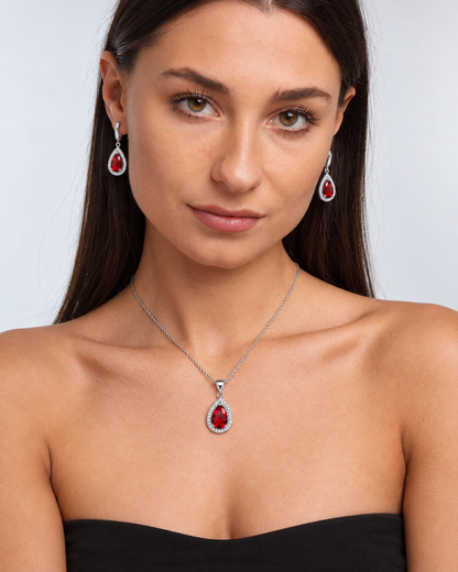 Colour Crystal Teardrop Necklace & Earring Set in Red, worn by a model in a front portrait - Ravyena