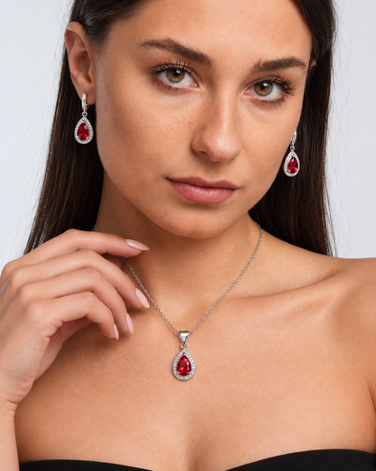 Colour Crystal Teardrop Necklace & Earring Set in Red, worn by a model in a close-up - Ravyena