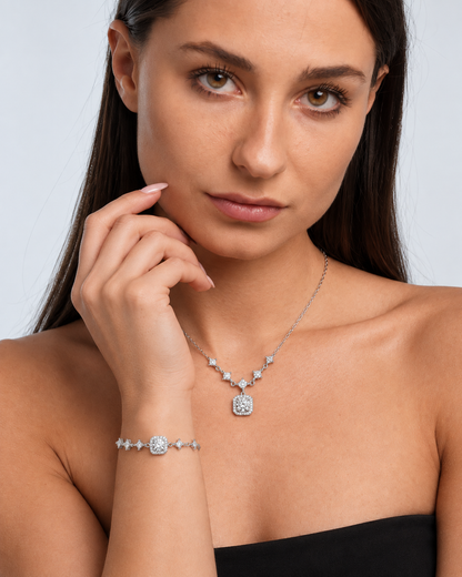 925 Sterling Silver Moissanite Necklace & Bracelet Set in Silver, worn by a model in a close-up - Ravyena