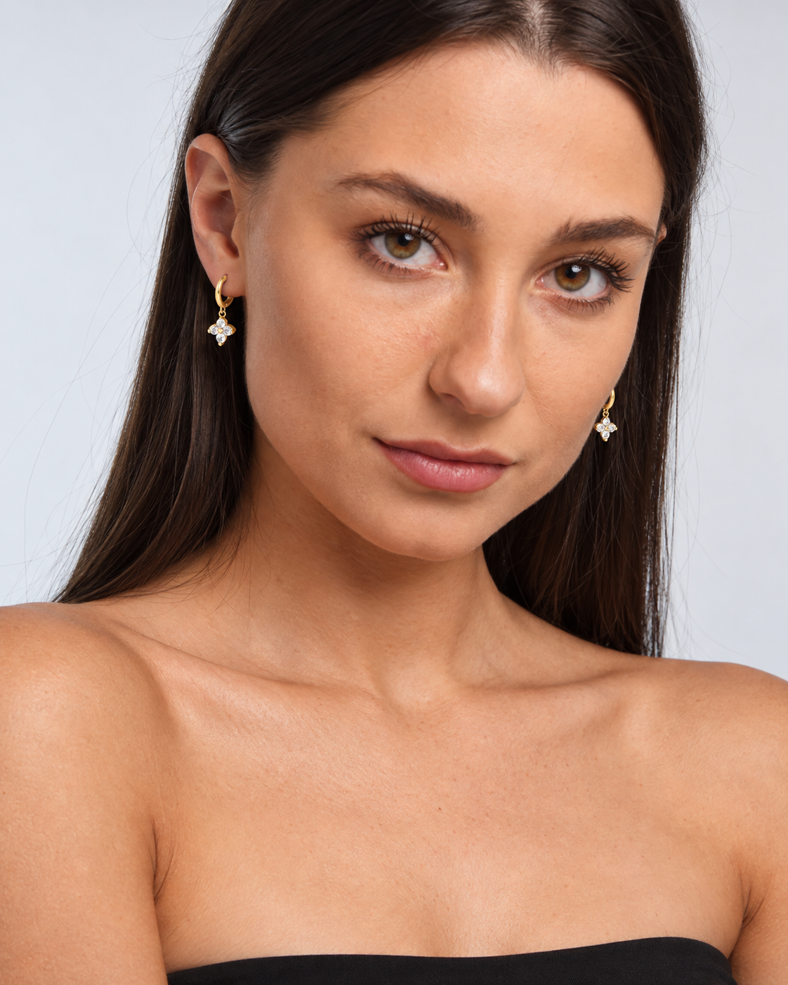925 Sterling Silver Crystal Flower Hoop Earrings in Gold, worn by a model in a front portrait - Ravyena
