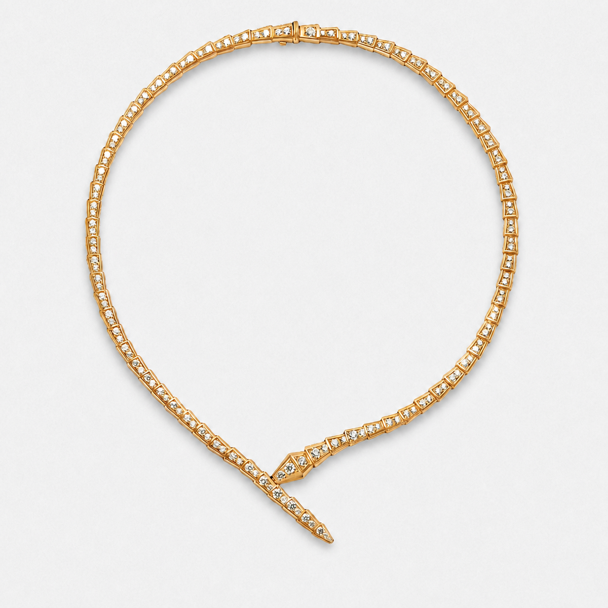 Crystal serpent choker necklace with articulated links and crossed front ends in a gold finish on a neutral off-white background.