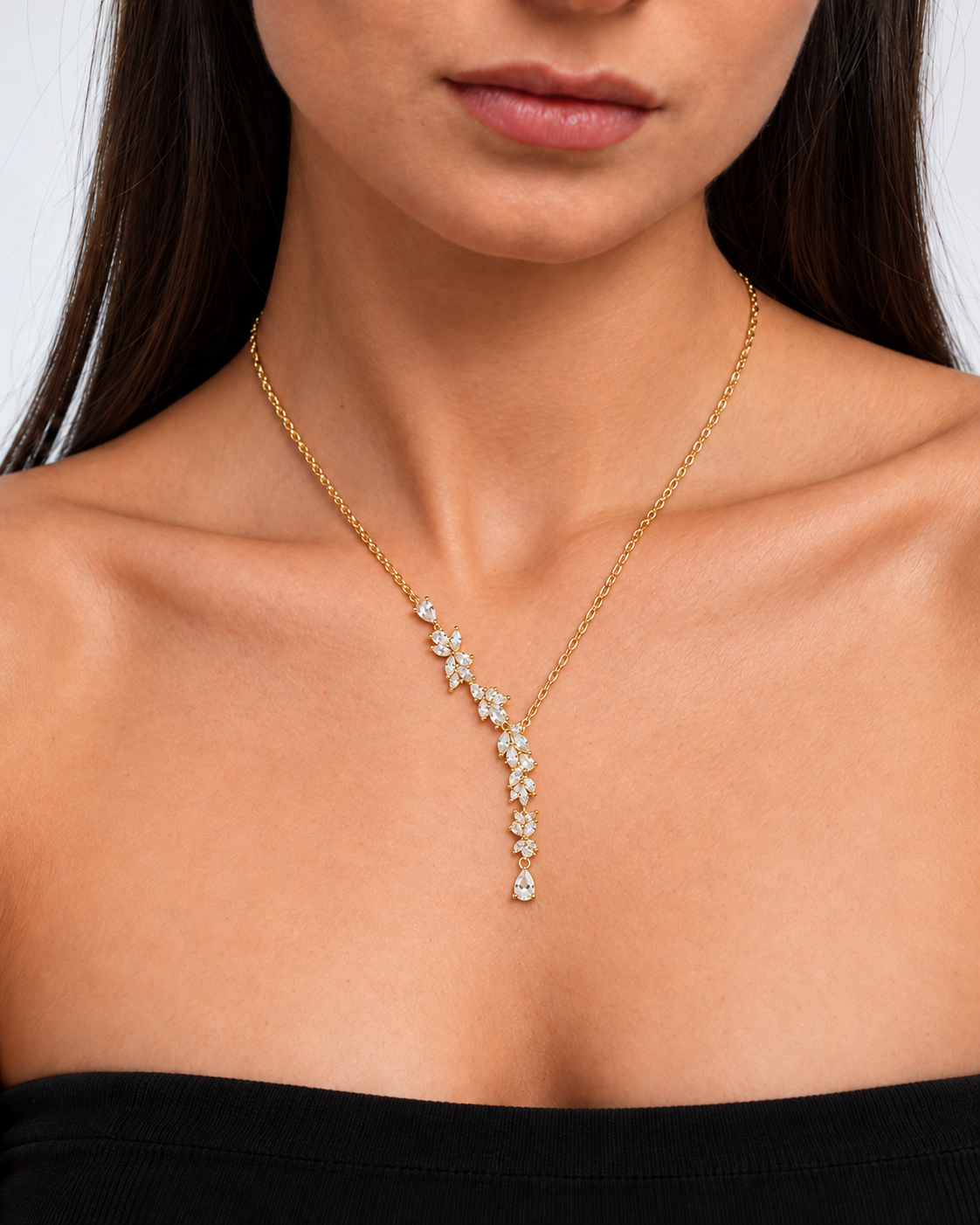 Wisteria gold-coloured floral Y necklace worn on the neckline in close view