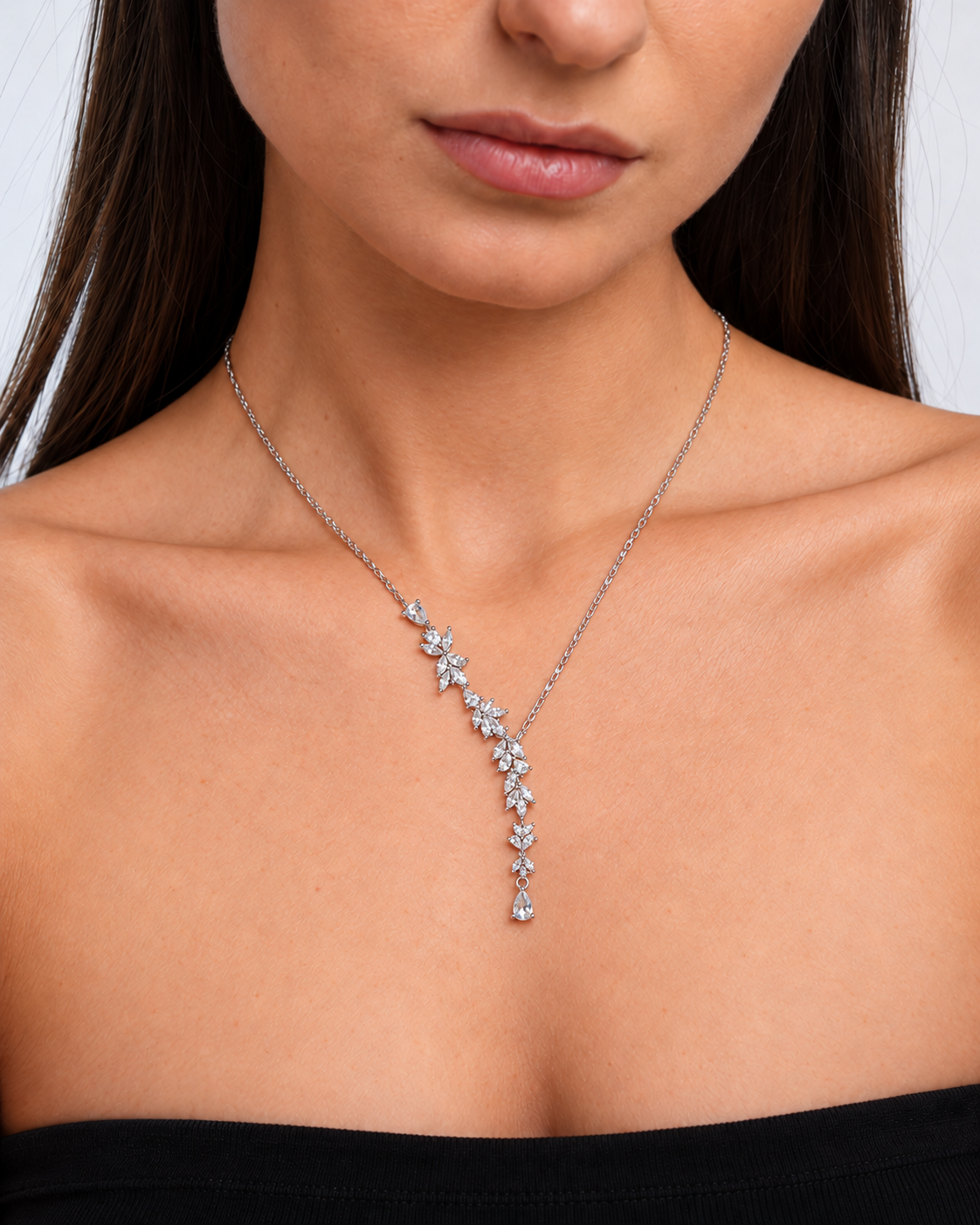 Wisteria silver-coloured floral Y necklace worn on the neckline in close view