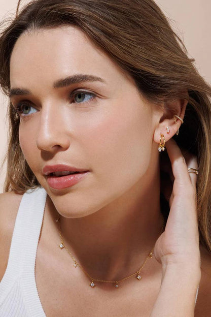 Star necklace styled on a model's neckline