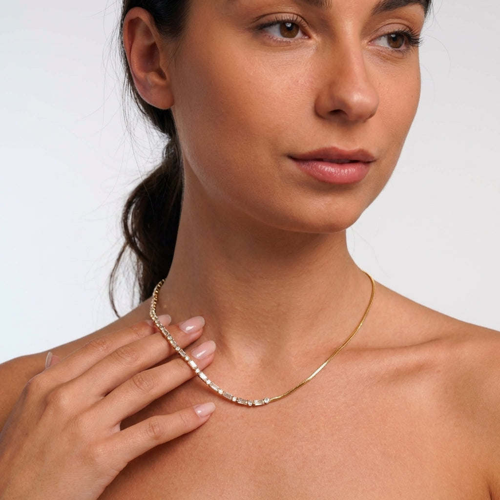 Crystal tennis necklace styled on a model's neckline