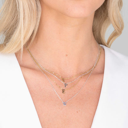 Cursive initial necklace lifestyle layered styling