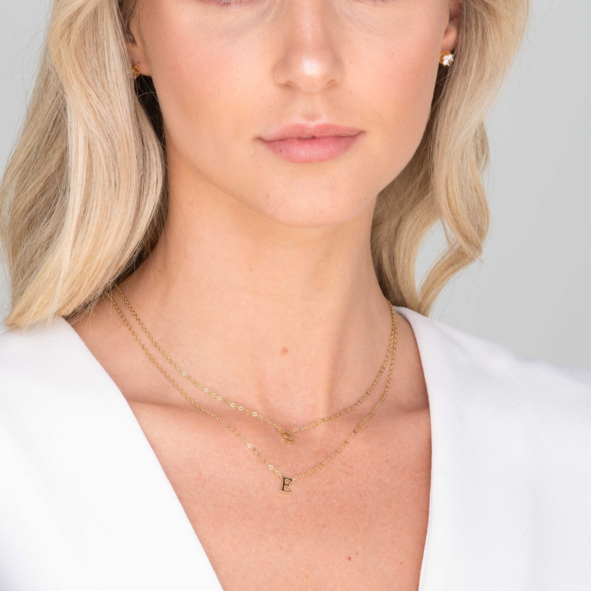 Cursive initial necklace variation G styled on a model