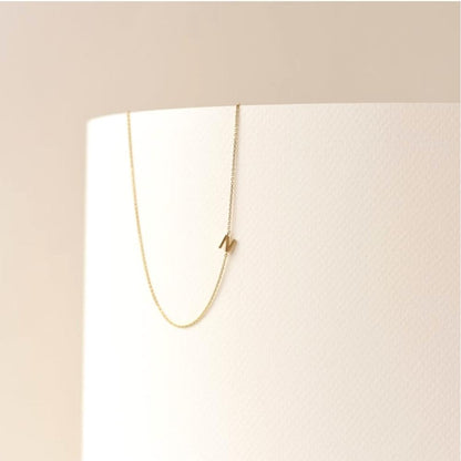 Sideways initial necklace variation D in 18K gold