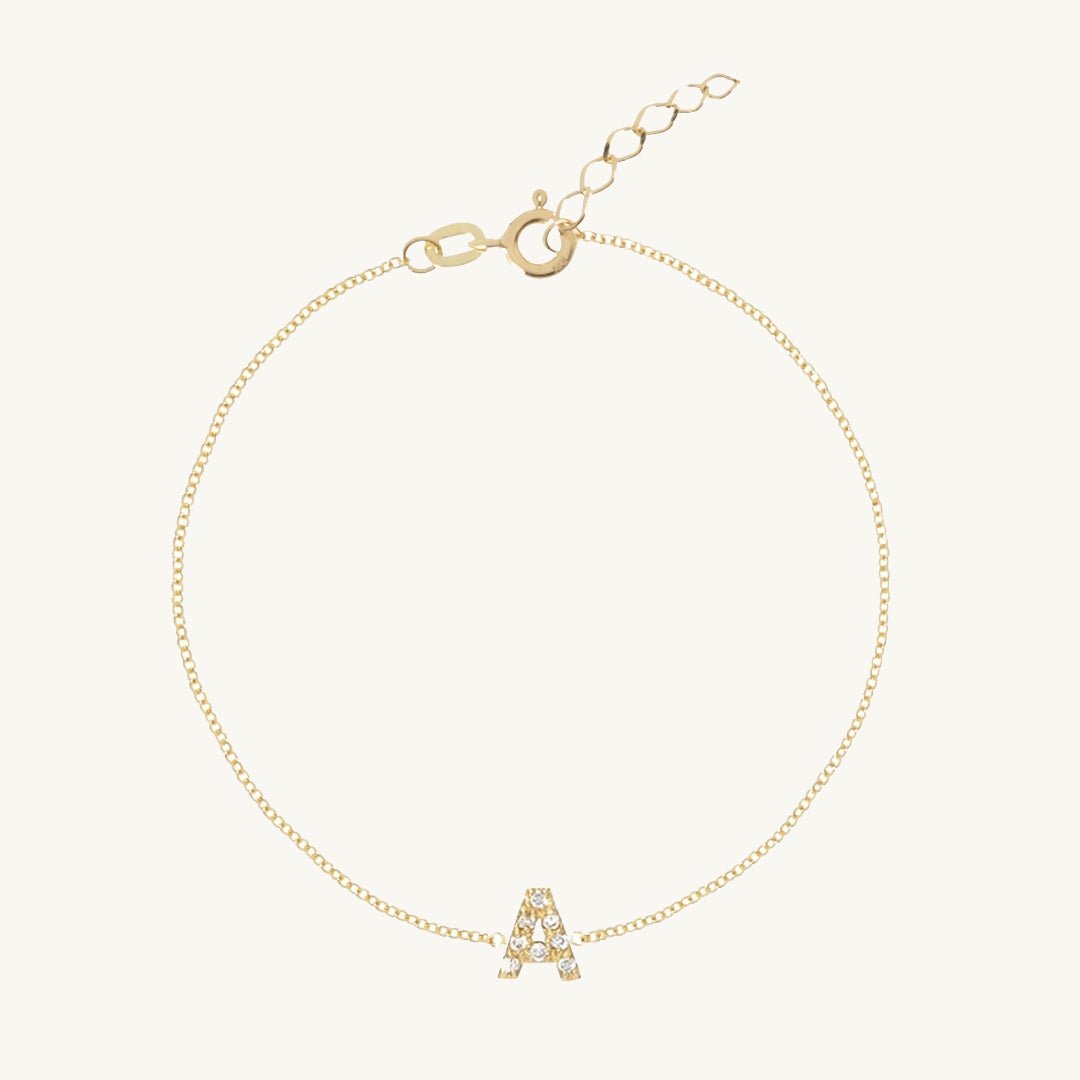 Sapphire letter bracelet styled on a feminine wrist