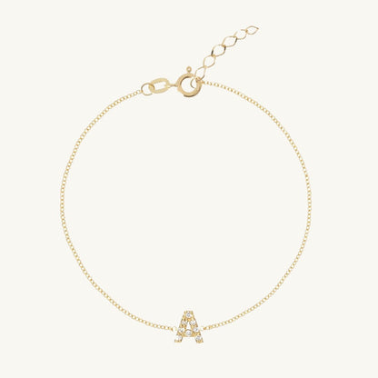 Sapphire letter bracelet styled on a feminine wrist