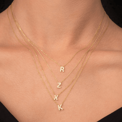Sapphire letter pendant in gift packaging presentation
