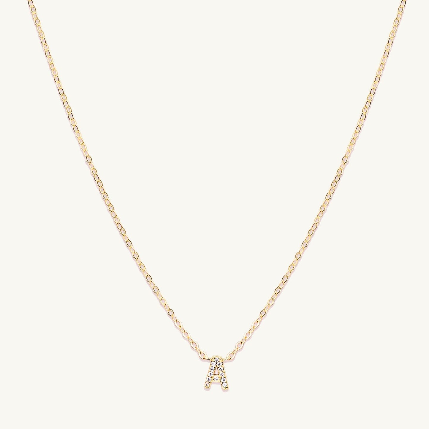 Sapphire letter necklace variation H on a delicate gold chain