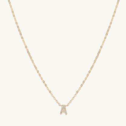 Sapphire letter necklace variation H on a delicate gold chain