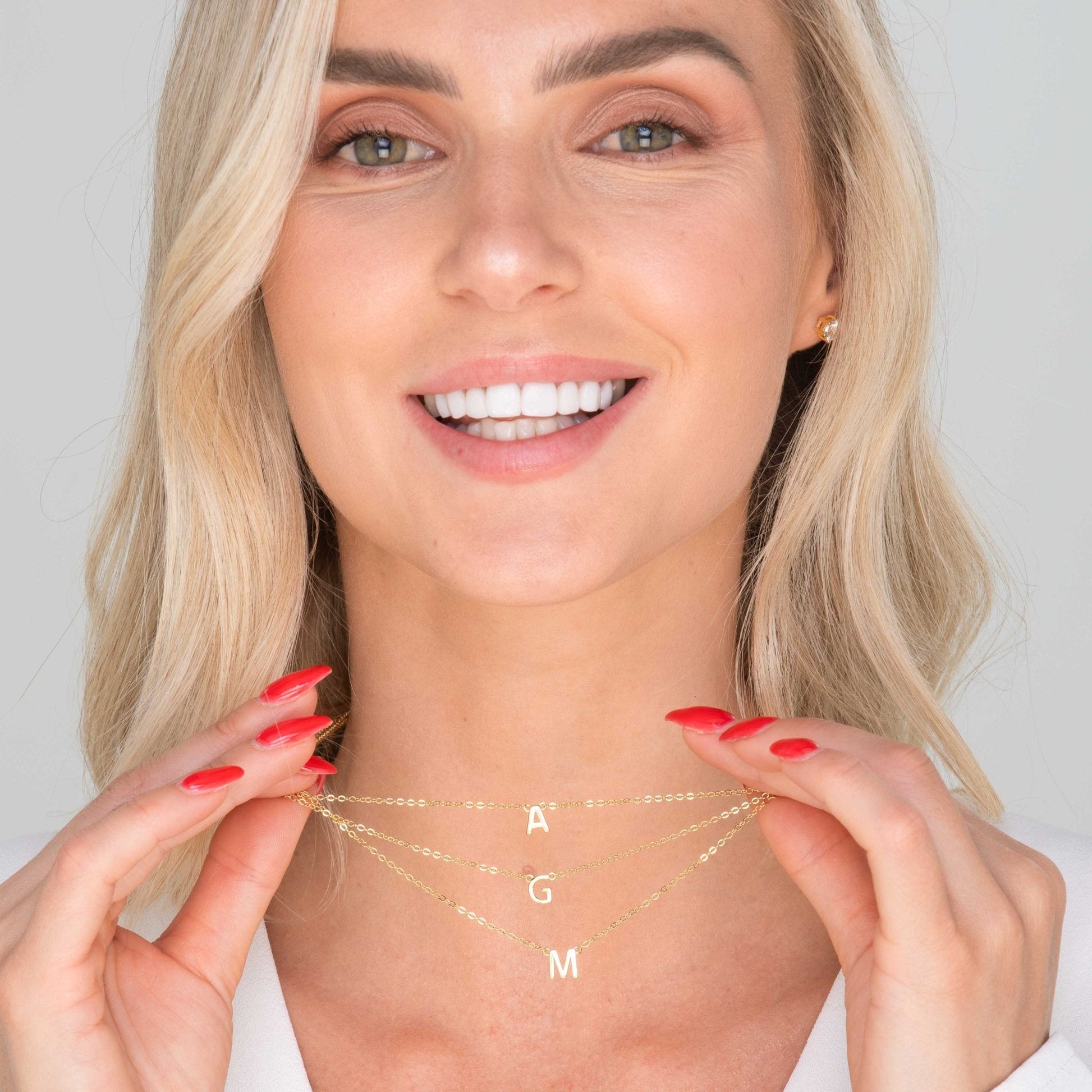 18K gold vermeil letter necklace styled on a model