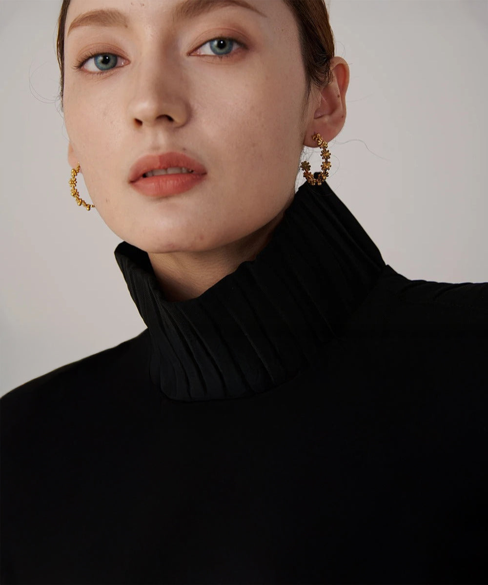 Gold floral hoop earrings with delicate flower detail