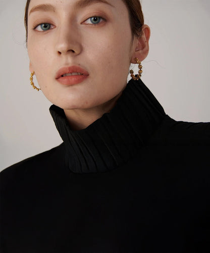 Gold floral hoop earrings with delicate flower detail