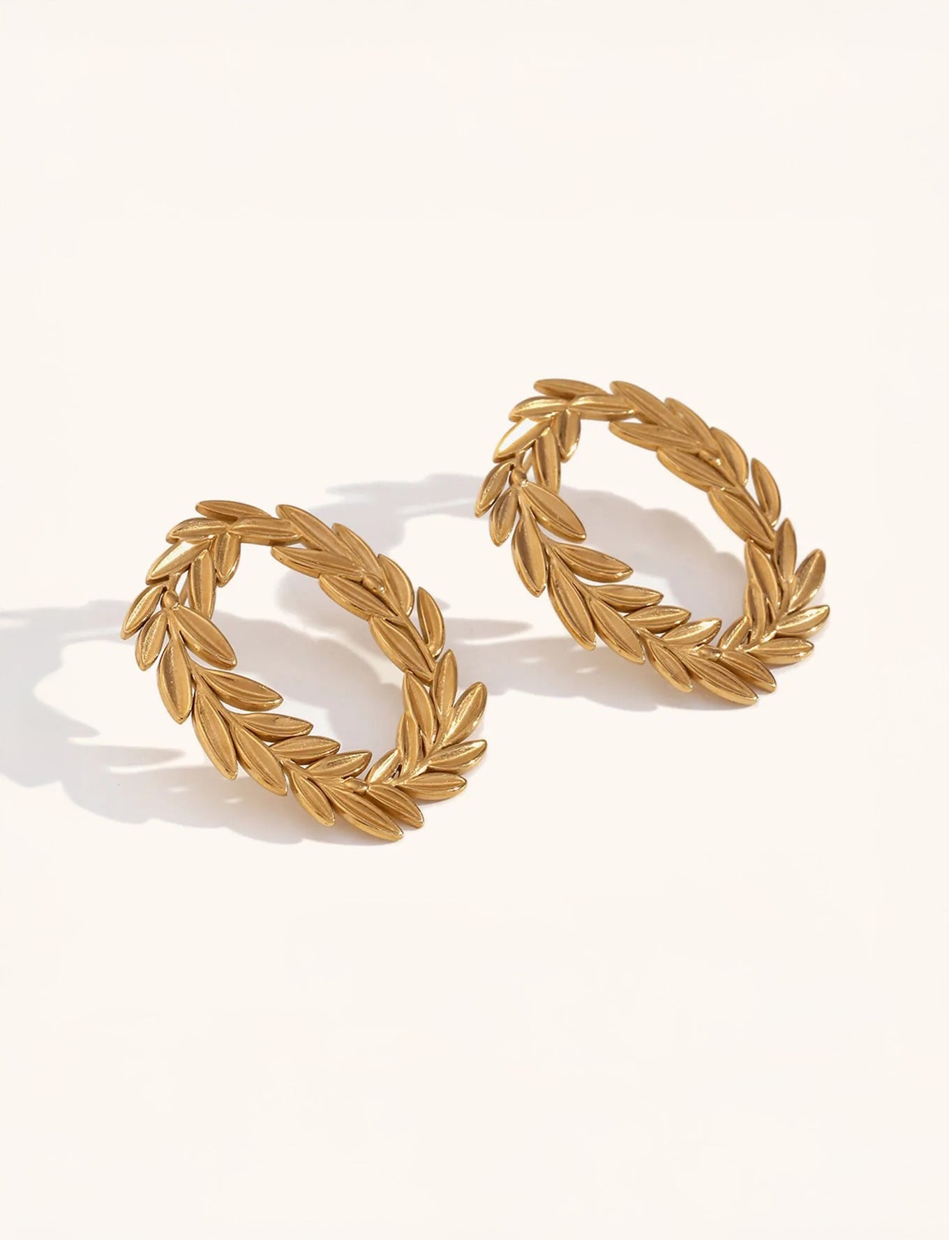 Gold sculptural hoop earrings – side profile