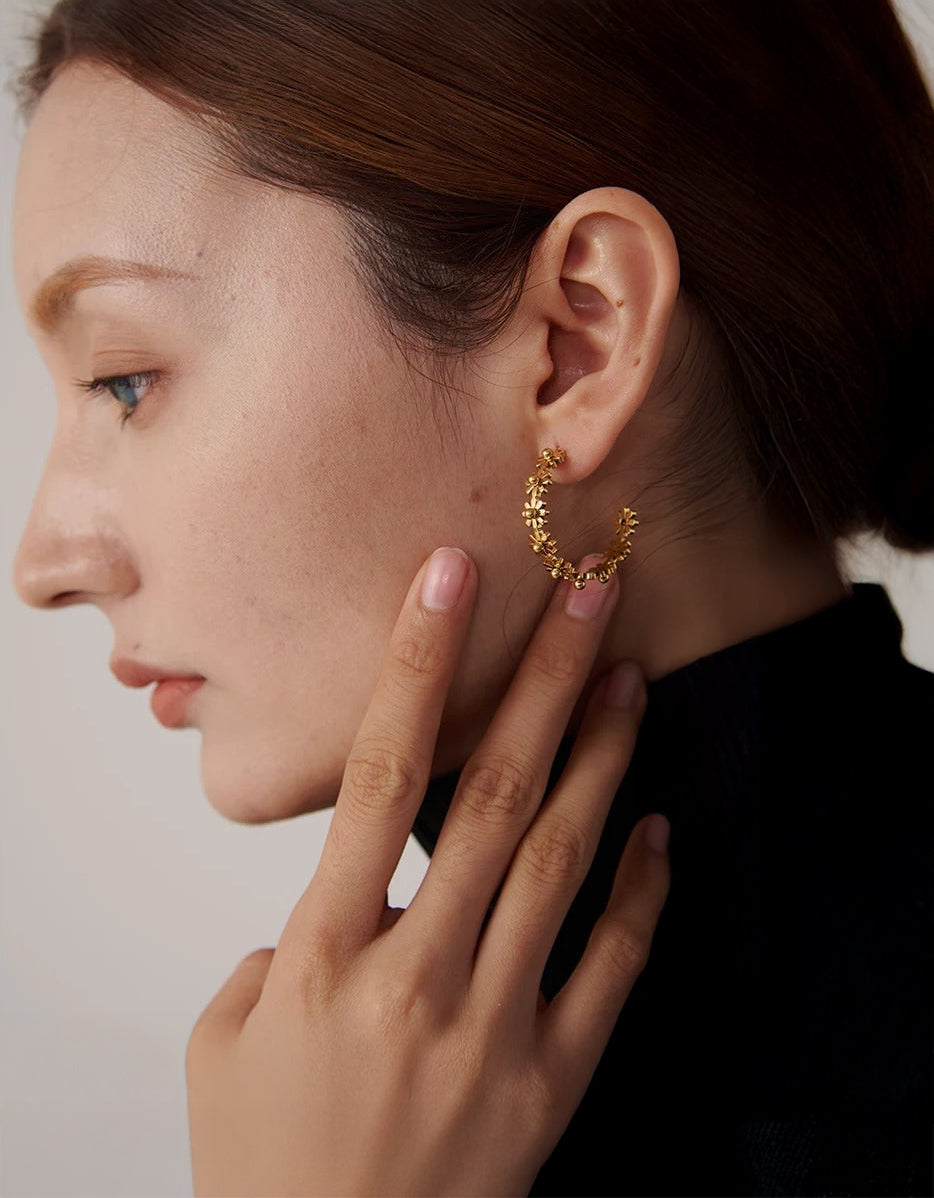 Floral wreath hoops styled on a model's ear